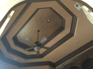 Close shot of the brown ceiling with a fan