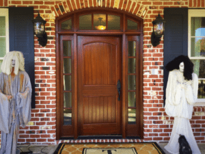 Front view of the house door with two mannequins in front