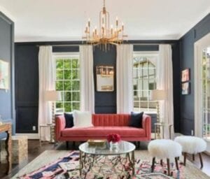 Living room in charcoal gray color with sofas and teapoy