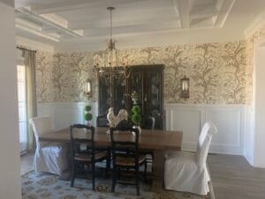 Wooden dining table with four chairs with two plant pots