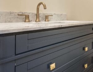 Closeup shot of a wash area with taps in copper color