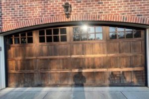 Wooden garage door with glass panels.