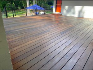 Wooden deck with a light wood stain.