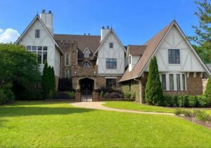 Tudor style home with gated entrance.