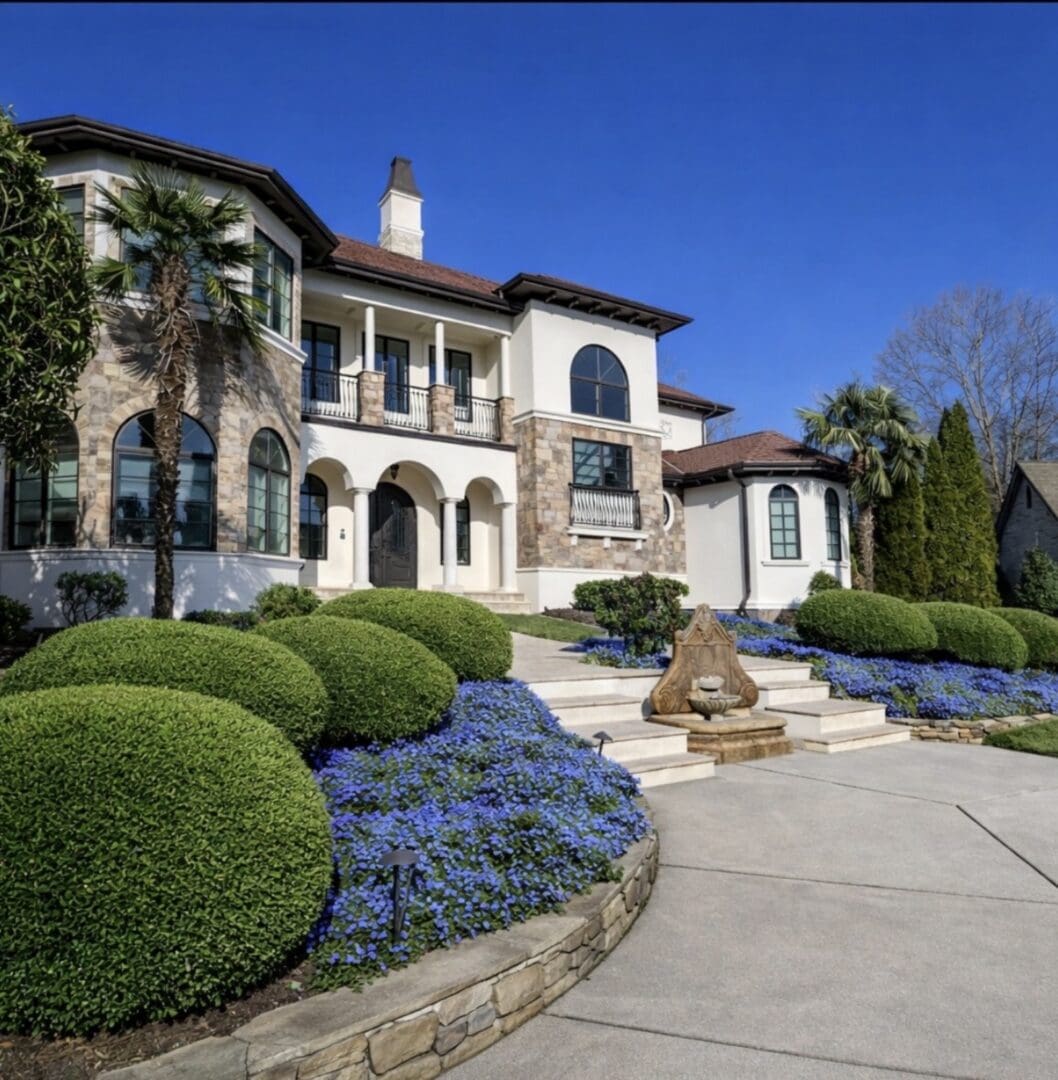 Mediterranean mansion with fountain and manicured gardens