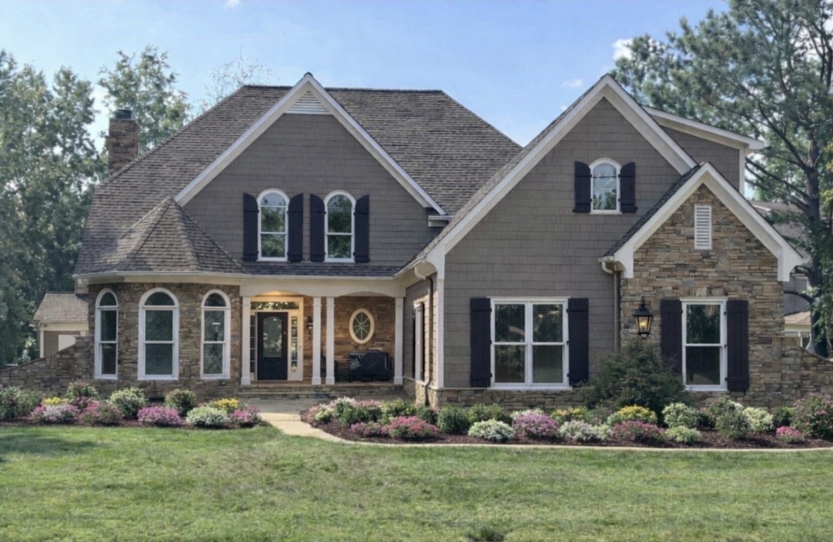 Large two-story house with stone facade