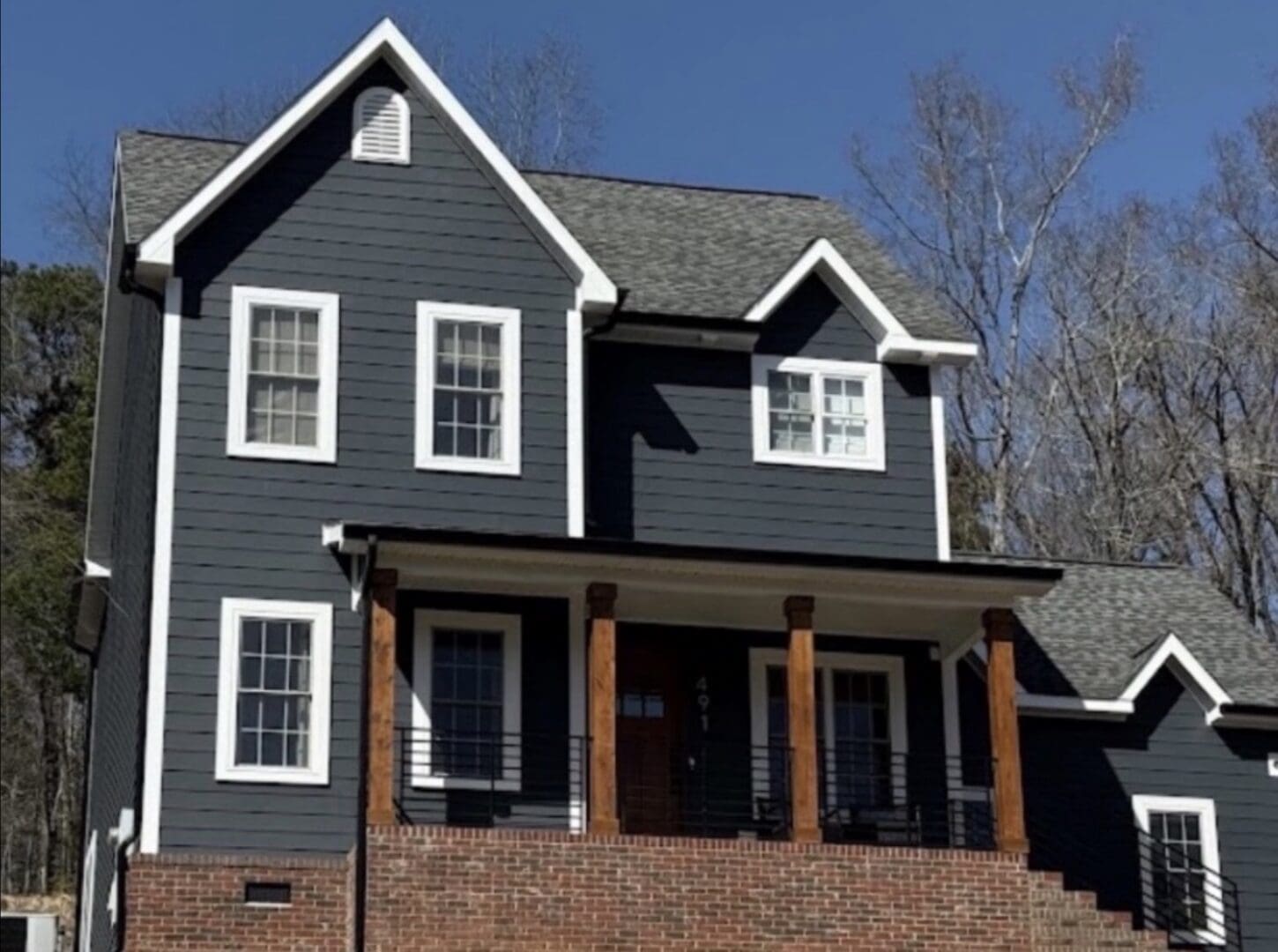 Dark gray siding house second-floor view