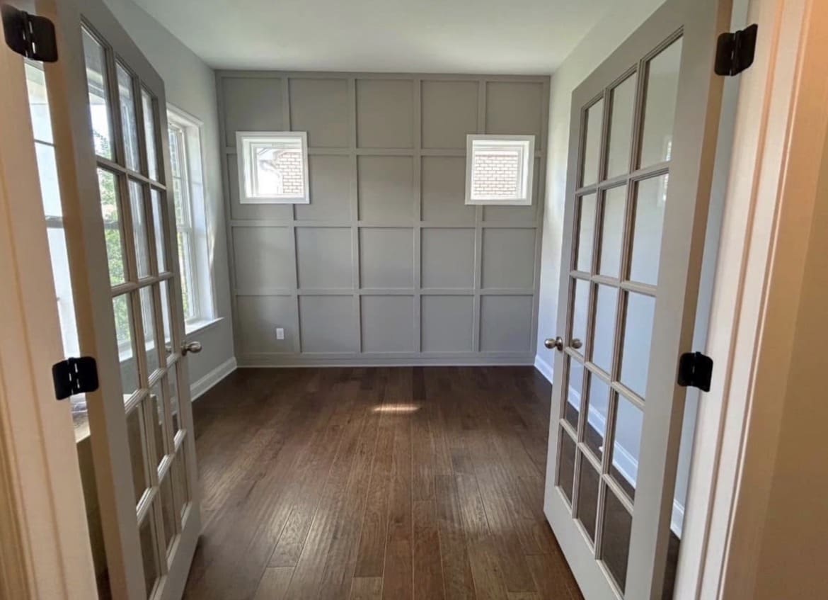 Home office with French doors and wood floor